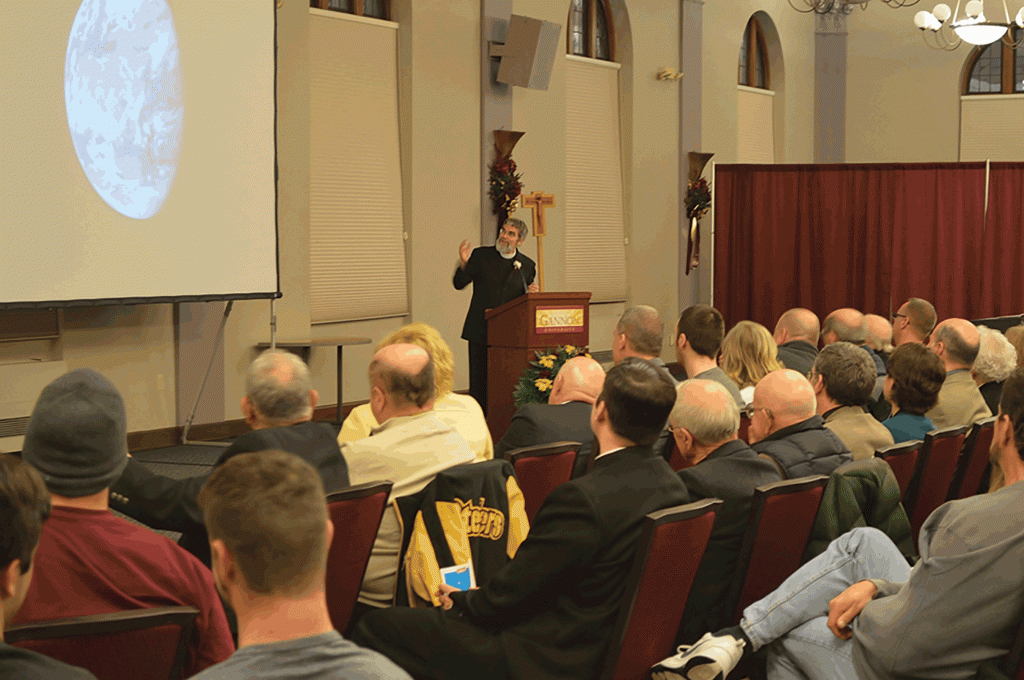 Brother Guy Consolmagno, S.J., Ph. D., speaks during Wednesday’s Bishop Donald Trautman lecture in Yehl Ballroom. The lecture was titled “God, Astronomy and the Search for Elegance.”