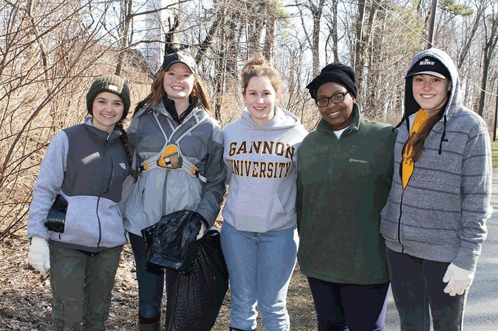 Maddy Schwerinski, Amber Stilwell, Holly Dill, Kristal Ambrose and Amanda Hennessy pose after a program to clean up Presque Isle.