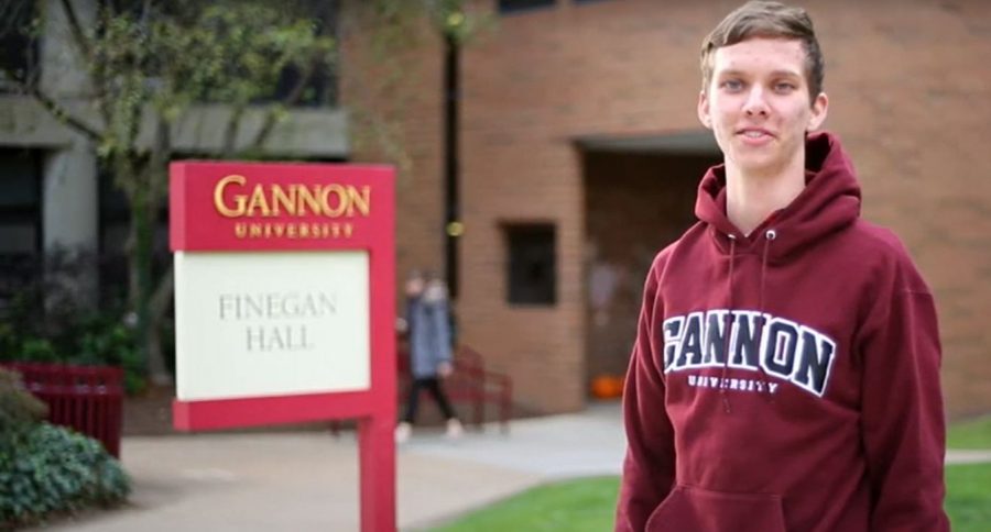 Justin Johnson stands in front of Finnegan Hall