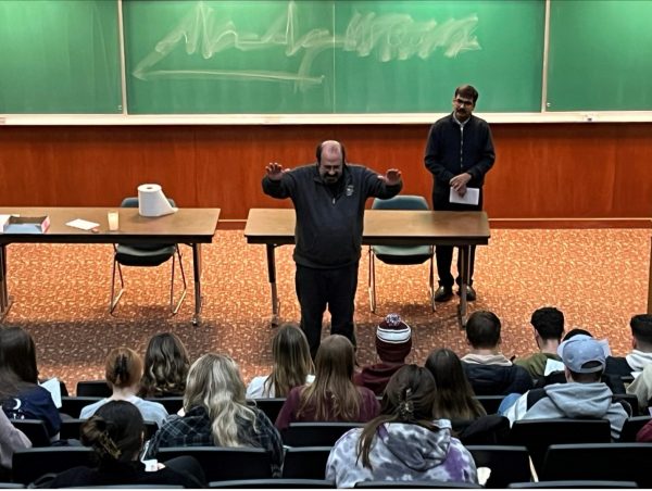 Gannon University Chaplain Father Michael Kesicki offers the blessing in Human Gross Anatomy at the conclusion of their end-of-semester prayer service. According to Father Kesicki, a blessing asks God for purpose and direction for someone