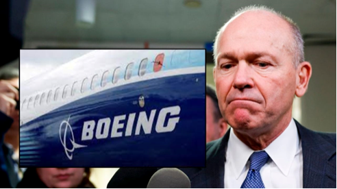 Boeing CEO David Calhoun and the Boeing emblem on the side of a plane 