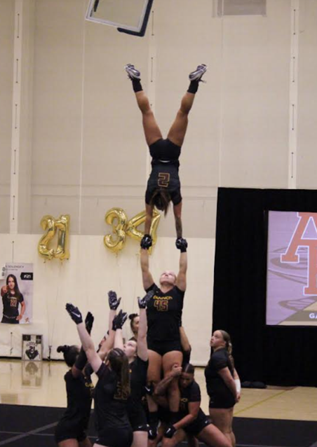 Brianna Arre performing at an Acrobatics and Tumbling competition.