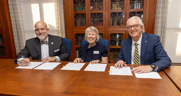 Dr. Walter Iwanenko, Dr. David King, and Sister Laura Bregar signing the letter of intent for a future partnership.