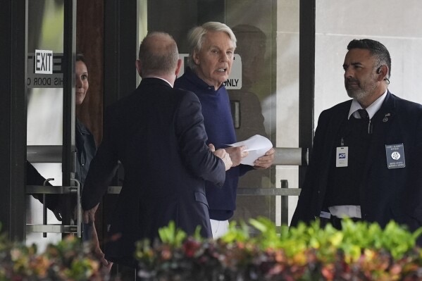 Micheal Jeffries (center) leaves the Paul. G. Rogers Federal Building and U.S. Courthouse (West Palm Beach, Florida) following a hearing on Oct. 22, 2024. 