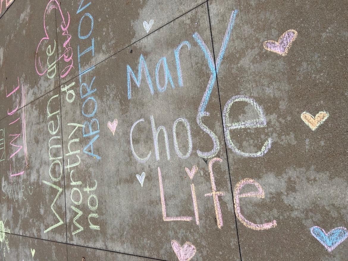 Chalk outside of Nash voices "Pro-Life" opinions and gains attention of "Pro-Choice". 