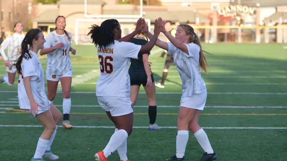 Gannon women’s soccer players #36 Jessie Watkins and #7 Brooklyn Respecki high-five after a goal.