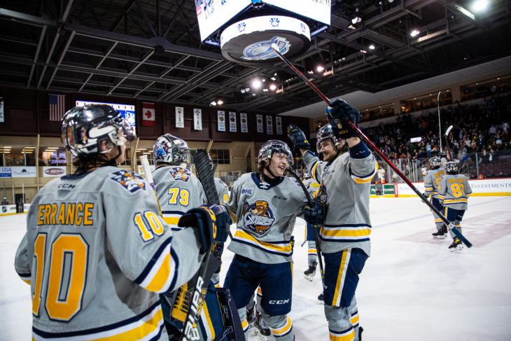 Erie Otters players celebrate win.