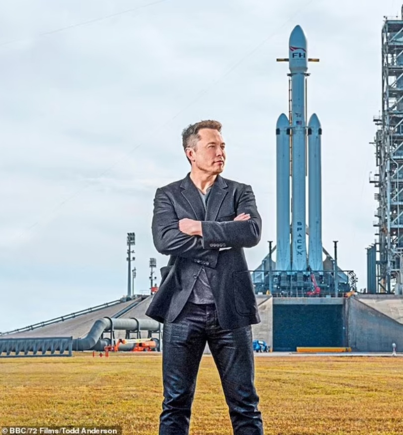 Elon Musk standing in front of a rocket (Photo/Todd Anderson)