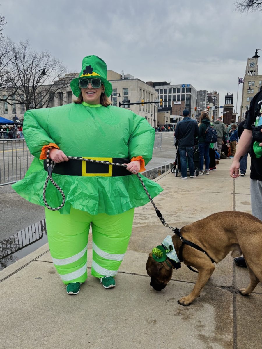 Some attendees revel in the holiday, dressing in up over the top costumes such as this proudly wore inflatable leprechaun outfit. Even her dog is festive with a tiny green top hat on its head