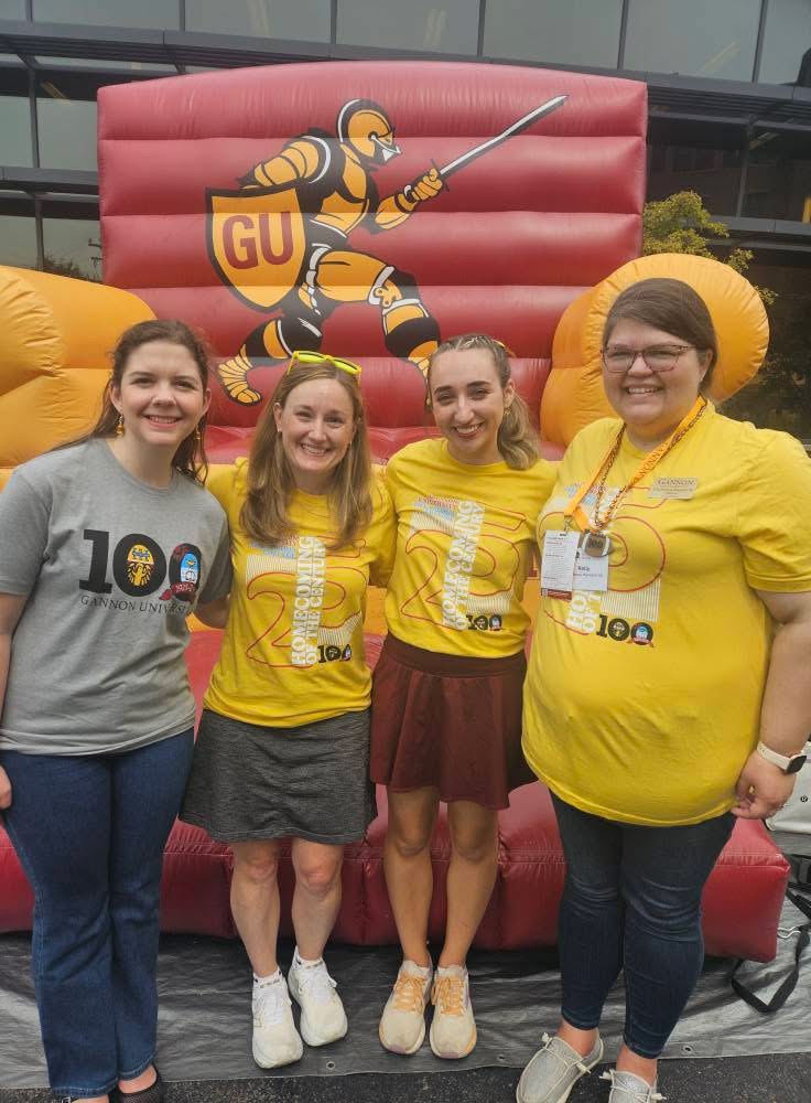 Pictured: (from left to right) Lydia Fennessy, '20, Sarah Ewing, Ph.D. (provost and vice presidentfor student experience at Gannon University), Madeline Emerson, '26, Kelly (Fennessy)Meredith, '08 at the Centennial Homecoming and Family Weekend Tailgate. 