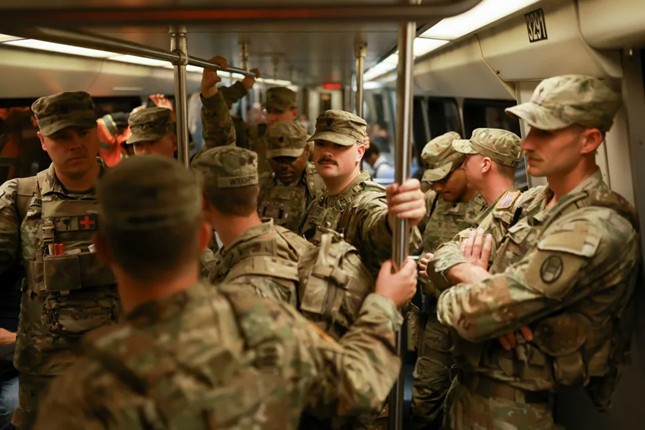 An obvious presence.
South Carolina National Guard members riding a Metro train. (Photo/Jose Luis Gonzales/Reuters)