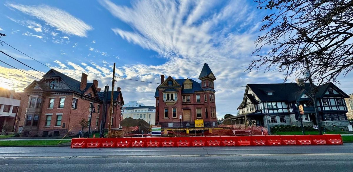 Pictured: The Olds-Sweet-Norman House (middle) sitting in its new location next to the newly renovated Carter-Shannon House (left) and Gannon University Alumni House (right).