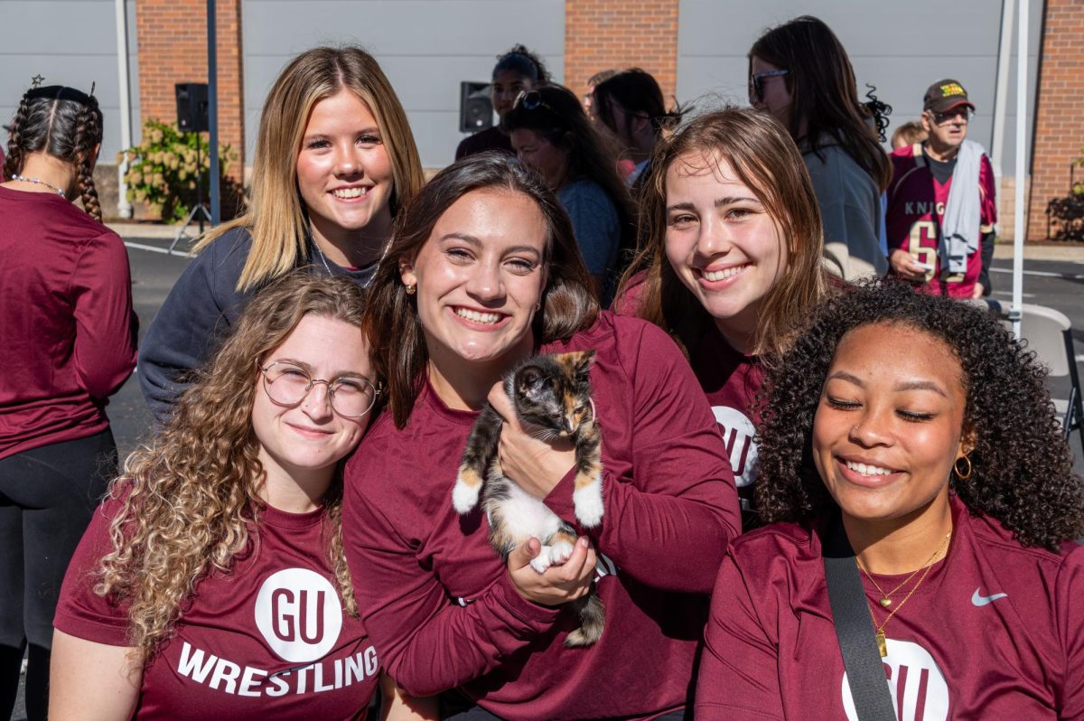 Gannon’s Women’s Wrestling team poses with a kitten during Gannon’s Homecoming and Family Weekend tailgate in 2024. (Photo/Andy Lapiska)