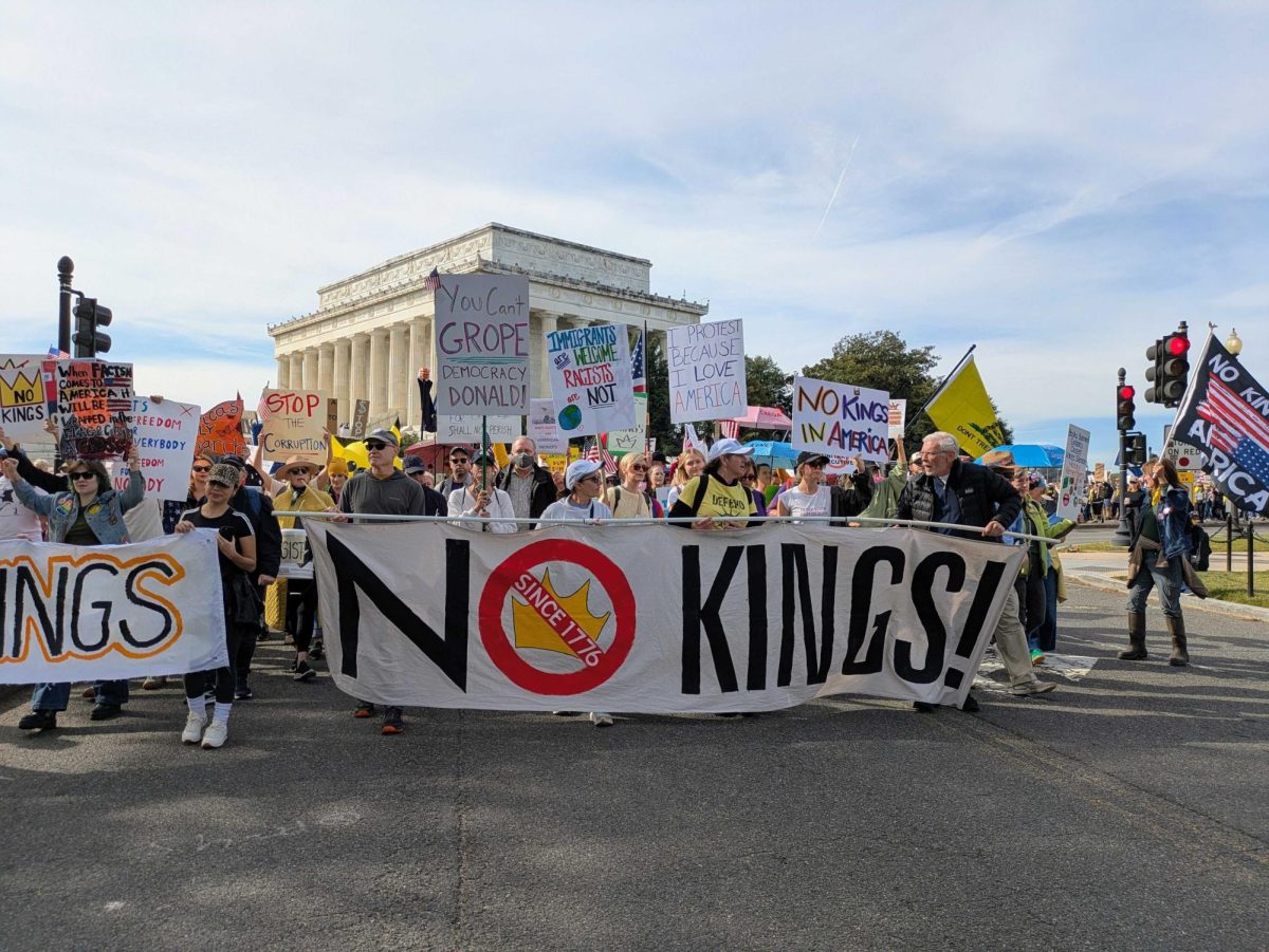 Protestors display signs and flags at Washington D.C. rally (Photo/Ashley Murray, States Newsroom, Oct. 18, 2025)