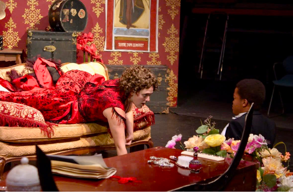 The scene when Sarah crawls on the couch to talk with Digby. (Photo/The Schuster Theatre)